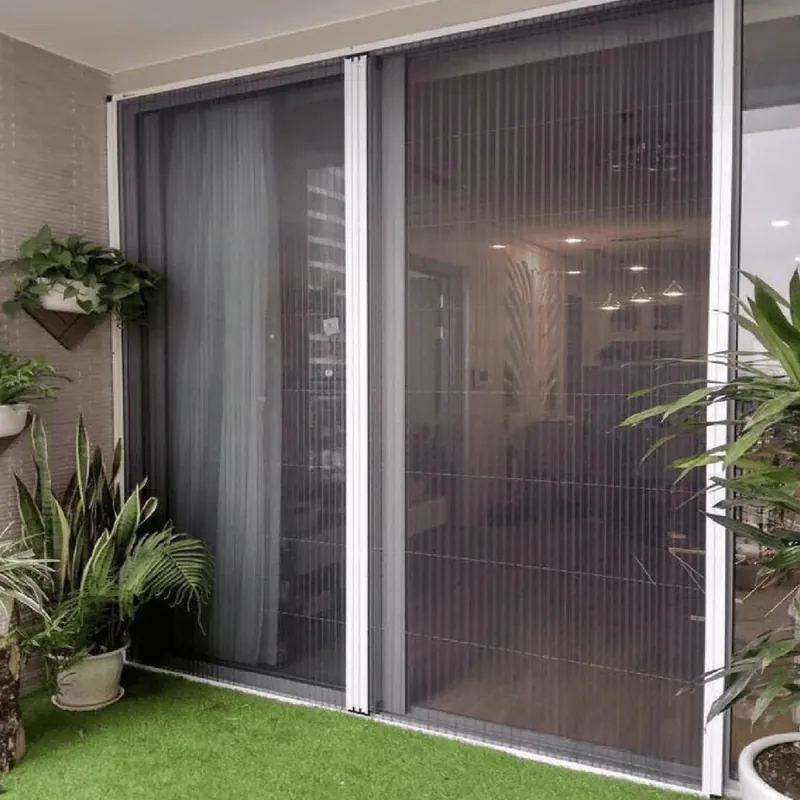 Mosquito mesh doors covering a wide balcony opening, with plants on the balcony