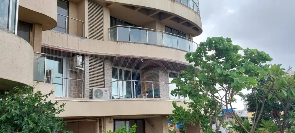 Apartment facade with invisible grills on curved balconies
