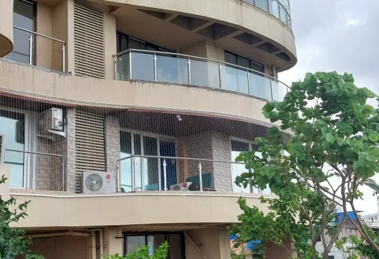 Apartment facade with invisible grills on curved balconies