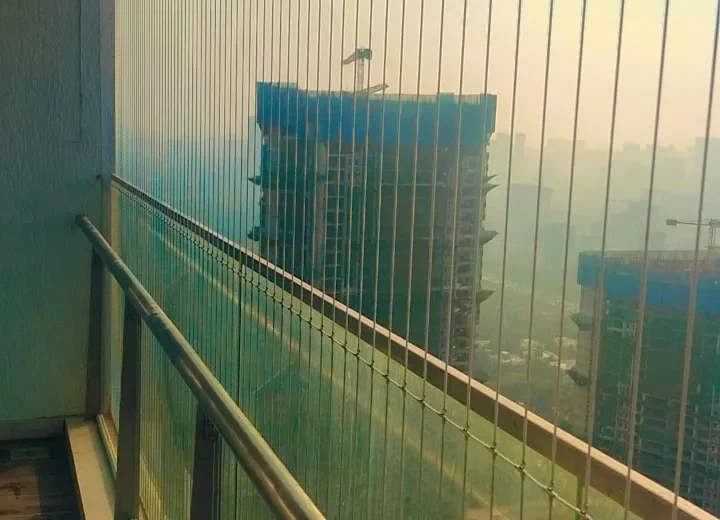 High-floor balcony with invisible grills overlooking the city